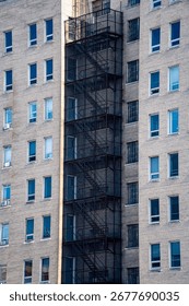 View of old building facade with external fire escape stairs.