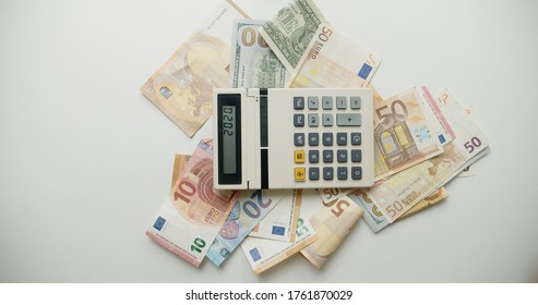 View Of An Old Calculator And International Paper Currency. Counted Summ On Calculators Screen. Money Signs. Counting Money. Home Finances Concept.