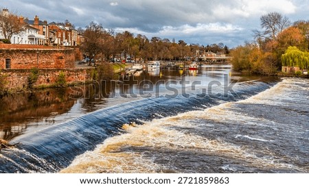 A view from the Old Dee Bridge across the weir on the River Dee in the city of Chester, Cheshire, UK