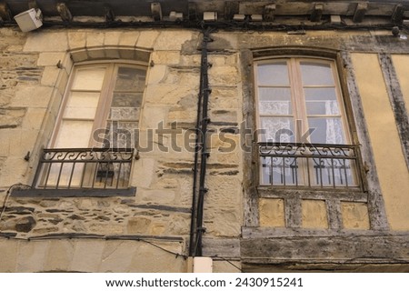 View of old facade of two houses in a medieval city in Normandy - Brittany (France)
