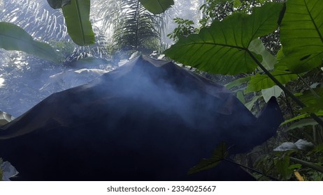 View of old house on mountain and smoke. Lots of smoke coming out of an old house. - Powered by Shutterstock