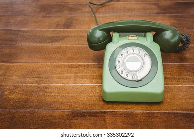 View Of An Old Phone On Wood Desk