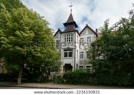 View of an old residential building with a tower on Moskovskaya Street on a sunny summer day, Zelenogradsk, Kaliningrad region, Russia