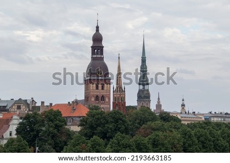 View of Old Riga with 3 church towers. Dome Church, Anglican Church and St. Peter's Church can be seen.
