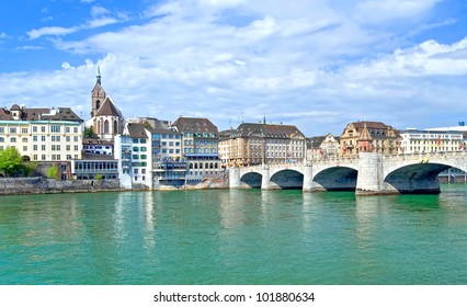 View of the old town of Basel, Switzerland with the River Rhine and the historic bridge and historic buildings