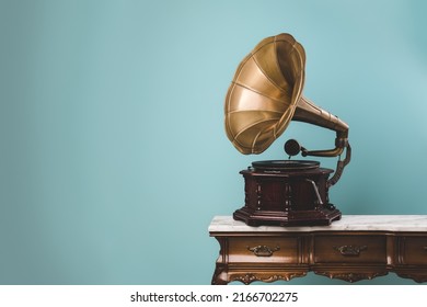 View of an old vintage gramophone on a table with copy space. Music and retro style concept.