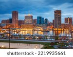 View on Baltimore skyline and Inner Harbor from Federal Hill at dusk, Maryland