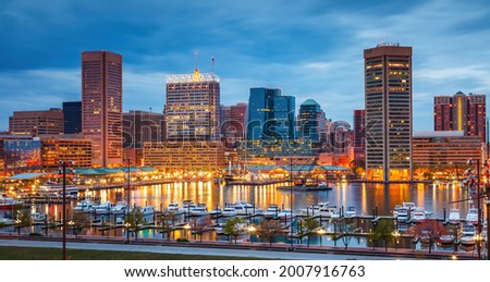 View on Baltimore skyline and Inner Harbor from Federal Hill at dusk