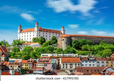View on Bratislava castle on the green hill with old houses at the bottom from the Michael's watch tower in Slovakia