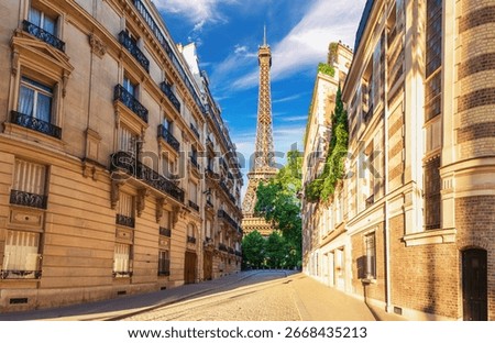 View on the Eiffel Tower from a typical street of France, famous landmark of Paris