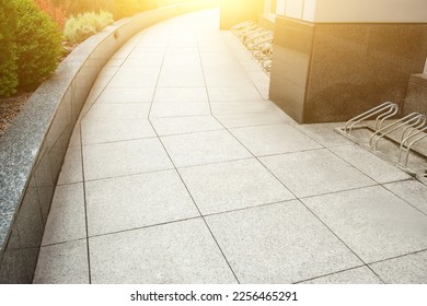 View on empty sidewal path and plants. Footpath covering