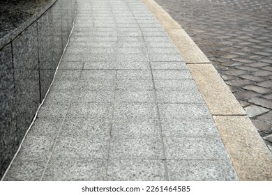 View on empty stone sidewal. Footpath covering