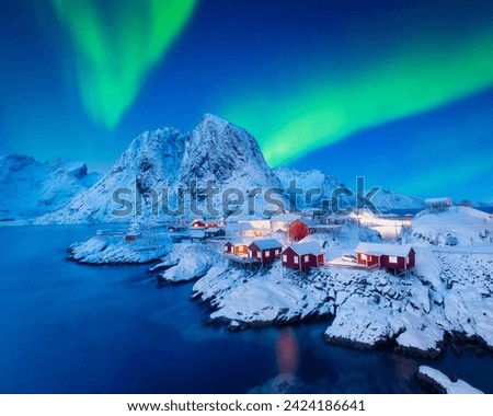 View on the house in the Hamnoy village, Lofoten Islands, Norway. Landscape in winter time during blue hour. Mountains and water. Travel image