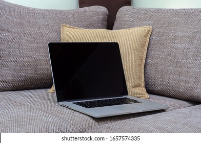 View On A Laptop Pc On The Sofa In A Home Office In A Home Office Environment In The Living Room.