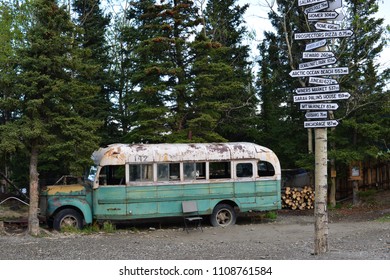 View On Magic Bus In Alaska With Road Signs