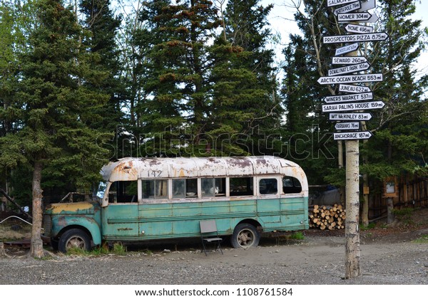 view on magic bus\
in alaska with road signs