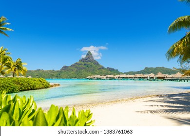 View On Mount Otemanu Through Turquoise Lagoon And Overwater Bungalows On The Tropical Island Bora Bora, Tahiti, French Polynesia, Pacific Ocean. 