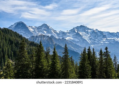 View on the mountain range Eiger Moench and Jungfrau in the Swiss alps on a sunny day - Powered by Shutterstock