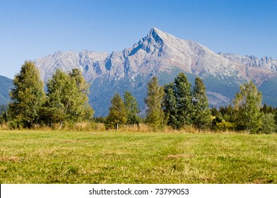 View on mountains of High Tatras in northern Slovakia, Europe. In the background peak Krivan (high 2494,7 m) - a symbol of Slovakia.