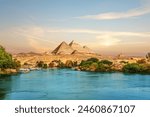 View on the Nile and the boats at sunset in the Aswan desert near the Pypamids of Egypt