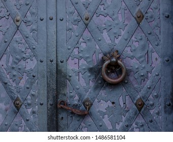 View on old purple door in a catle