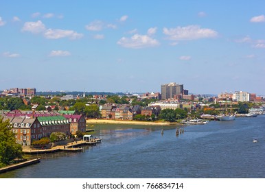 A view on old town Alexandria from the Woodrow Wilson Memorial Bridge, Virginia, USA. Potomac River panorama in early autumn.