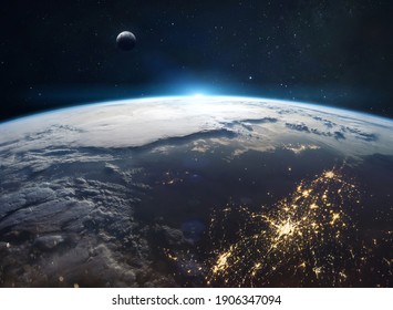 View on planet Earth from space. Cities lights and continents. Civilization on planet. Moon on background. Elements of this image furnished by NASA