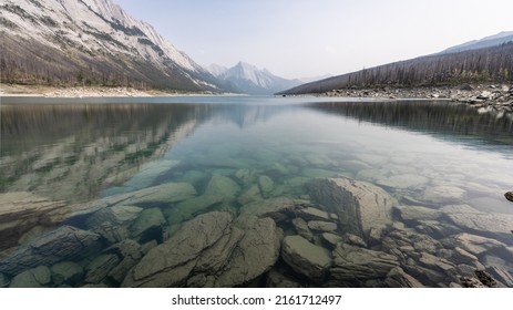 View on pristine alpine lake with clear water and mountain on its end, horizontal, Jasper NP, Canada