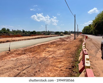 The view on a road that has been placed and compacted crusher run or subbase. Subbase is the layer of aggregate material laid on the subgrade, on which the base course layer is located. 