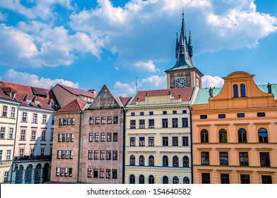 View on row of a different colored buildings in Prague near Karluv Most