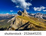 View on Seceda peak. Trentino Alto Adige, Dolomites Alps, South Tyrol, Italy. Odle mountain range, Val Gardena. Majestic Furchetta peak. Odles group seen from Seceda, Santa Cristina Val Gardena.