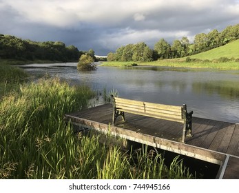View on Small jetty with seat and river Erne, co. Cavan , Ireland