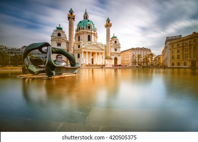 View on st. Charles's church on Karlsplatz in Vienna. Long exposure technic with blurred clouds and glossy water