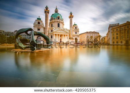 View on st. Charles's church on Karlsplatz in Vienna. Long exposure technic with blurred clouds and glossy water