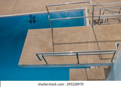 View On The Top Of Diving Platform At A Swimming Pool 