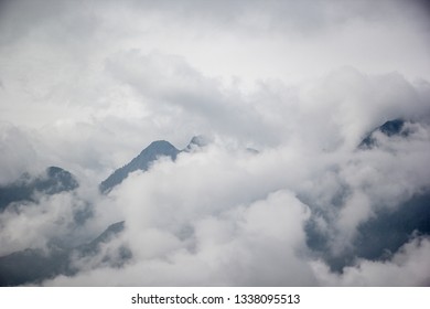 View on the top of a mountain with clouds