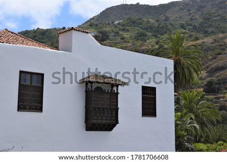A view on the wooden balcony on the white wall at Garachico, Tenerife, Canary islands, Spain. 