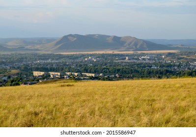 view from one mountain peak to another, a city in a mountain valley