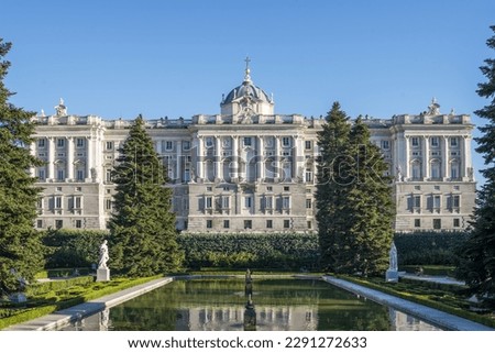 View of one of the side facades of the Royal Palace of Madrid with some gardens in the foreground