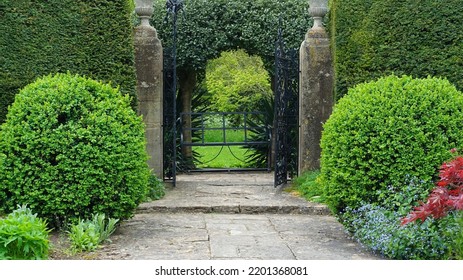 View Of An Open Gateway In A Beautiful Garden