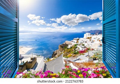 View from an open window of a luxury resort of the Aegean sea, caldera, coastline and whitewashed town of Oia, Santorini, Greece.