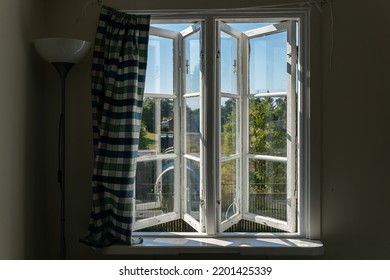 View From Open Window In The Village. White Old Wooden Windows With View On Blue Sky And Green Field. Symbol Of Insouciance, Freedom, Summer Atmosphere. Holiday House, Summer Cottage, Weekend Cottage.