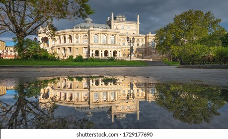 view to opera theater under dramatic sky with reflections in water in the morning with copy space in Odessa in Ukraine