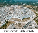 View of Ostuni white town, Brindisi, Puglia, Italy, Europe. Old town in southern Italy. Ostuni is referred to as the White Town. Ostuni white town skyline and church, Brindisi, Italy.