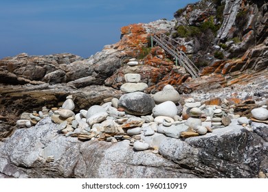 View Of The Otter Hiking Trail With A Rock Pile And Wooden Stairs