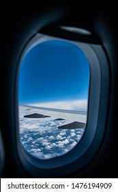 View Out Of Small Plane Window Of Cloudy Sky