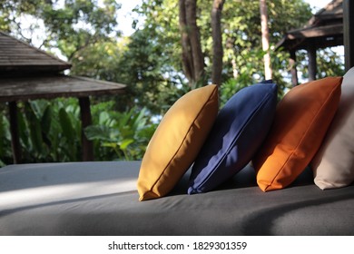 View Of Outdoor Bench With Seat Cushion In A Garden Of Local Resort In Phuket, Thailand. 