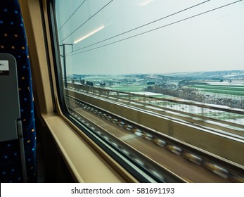 View Outside Of 300km/h Bullet Train Passing Snow Covered Crops In Louyang, China