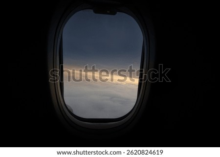 View outside from inside an airplane with clouds and horizon