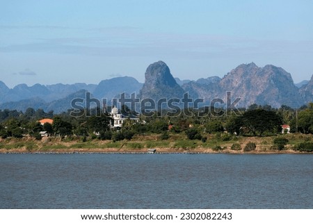 View over the border river Mekong to karst mountains in Laos, Nakhon Phanom, Isan, Thailand